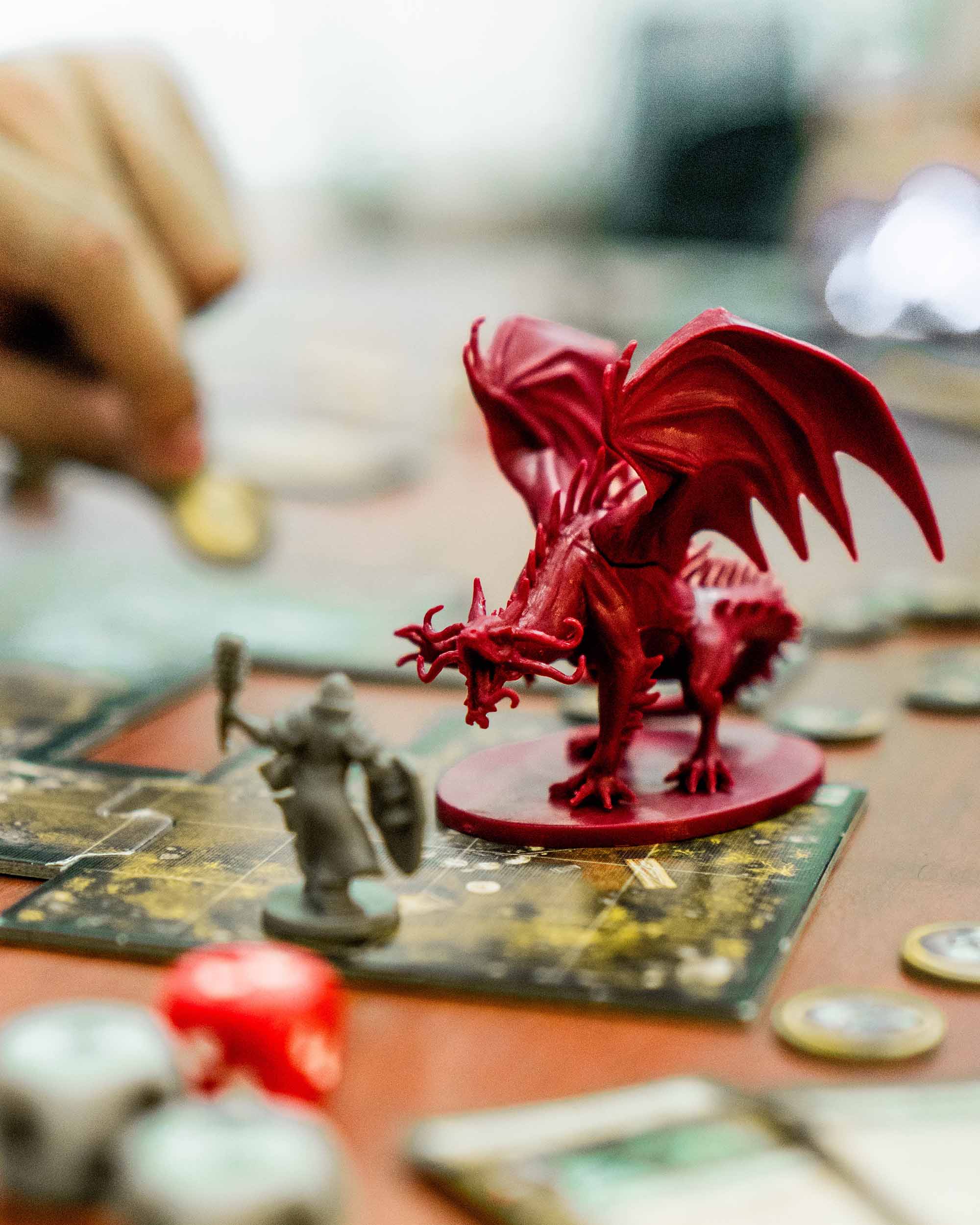 A dragon miniature on a board. Dragon